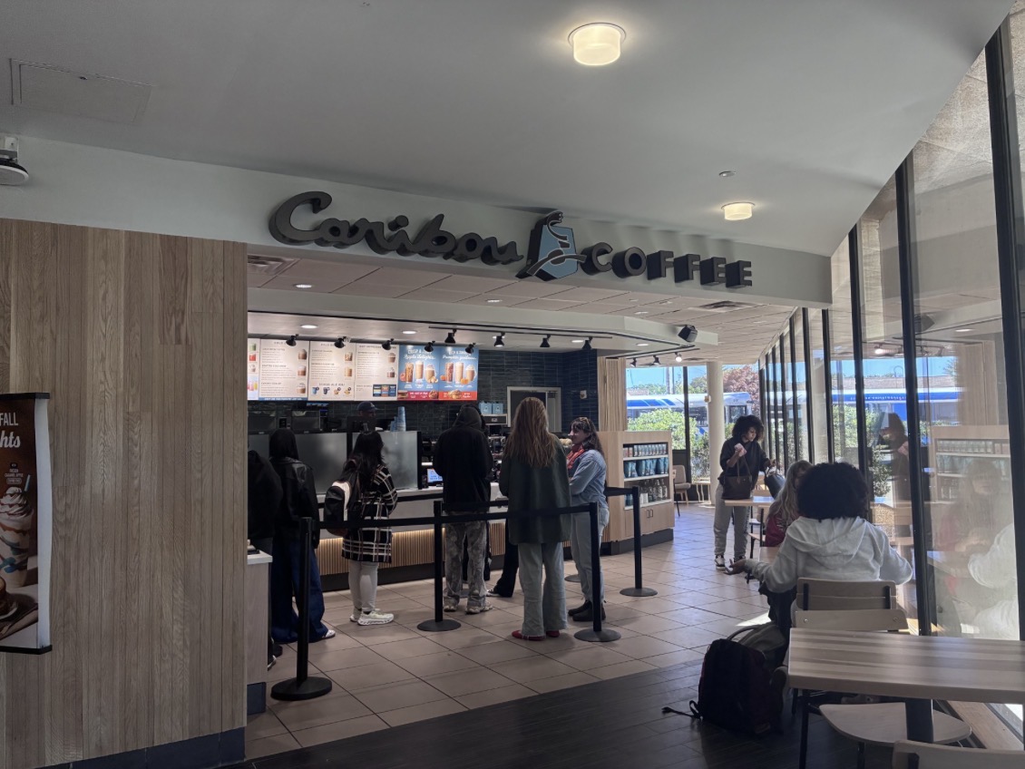 UMass Lowell students waiting in line to order drinks and snacks at Caribou Coffee